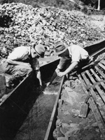 Photo, Two men searching for gold in a sluice flume, Thar's Gold in. . . site
