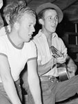 Photo, Young migratory agricultural workers singing at the Saturday night dance at the Agua Fria migratory labor camp, Arizona, May 1940, Russell Lee, Library of Congress
