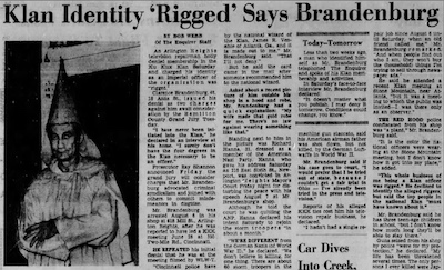 newspaper article with photograph of Brandenburg in his KKK robes. Title: “Klan Identity ‘Rigged’ Says Brandenburg