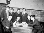 Image, boys around a desk Image, boys around a desk