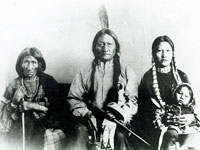 Photo, Portrait of Sitting Bull, his mother, and his daughter holding child, Miller, No date Photo, Portrait of Sitting Bull, his mother, and his daughter holding child