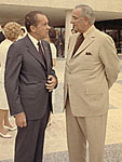 Photo, Nixon standing with Lyndon Johnson outside the LBJ Library in Austin, Texas, May 22, 1971, General Services Administration, NARA Photo, Nixon standing with Lyndon Johnson, 1971, NARA