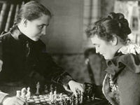 Photo, Helen and Anne playing chess, 1900, American Foundation for the Blind Photo, Helen and Anne playing chess, 1900, American Foundation for the Blind